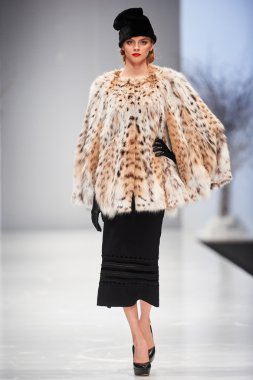 A model walks on the JULIA YANINA catwalk