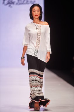 A model walks on the RAZU MIKHINA catwalk