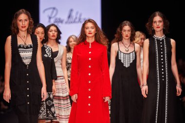 A model walks on the RAZU MIKHINA catwalk