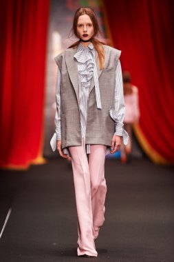 A model walks on the BESSARION catwalk