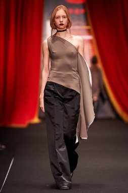 A model walks on the BESSARION catwalk