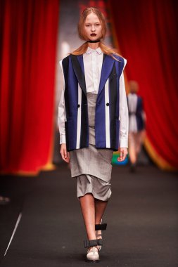 A model walks on the BESSARION catwalk