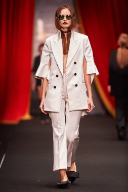 A model walks on the BESSARION catwalk