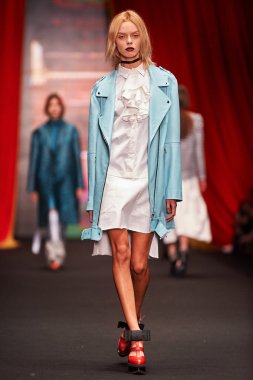 A model walks on the BESSARION catwalk