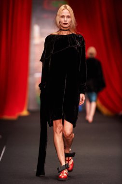 A model walks on the BESSARION catwalk