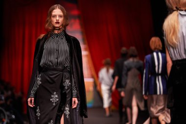 A model walks on the BESSARION catwalk