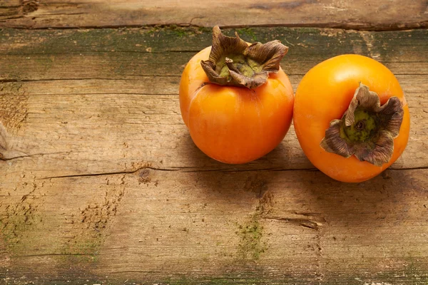 two delicious persimmons