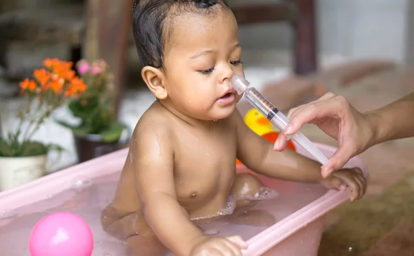 Asian baby saline nasal wash — Stock Photo, Image