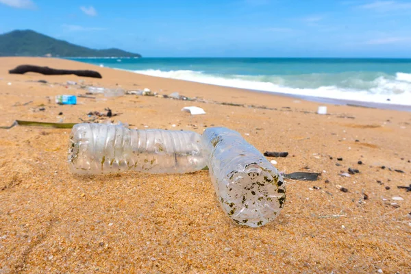 Plastic bottle waste is an environmental pollution on the beach.