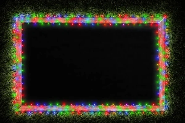 Vánoční Světla Pozadí Tabuli Rám Zelené Trávě — Stock fotografie