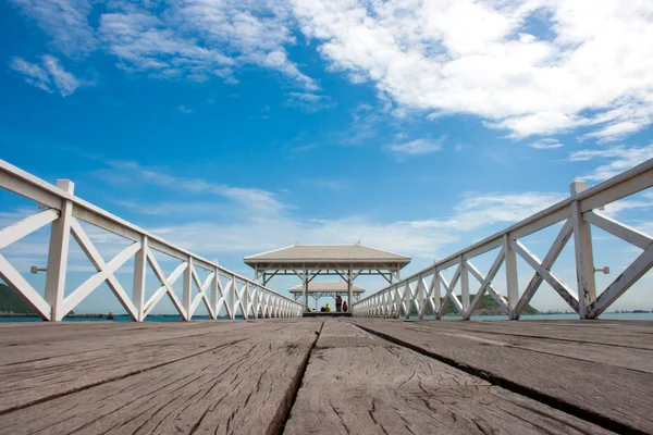 White wooden bridge in waterfront pavilion at the sea — Stock Photo, Image