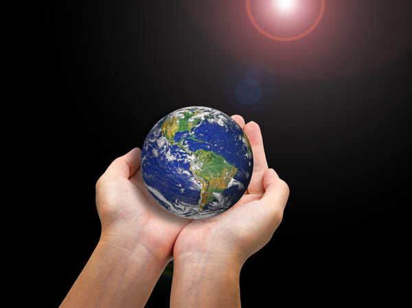 Earth planet in female hand isolated on white
