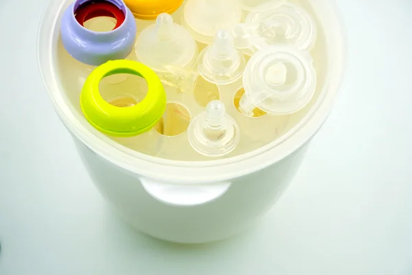 stock image Steaming and sterilizing milk bottles for baby