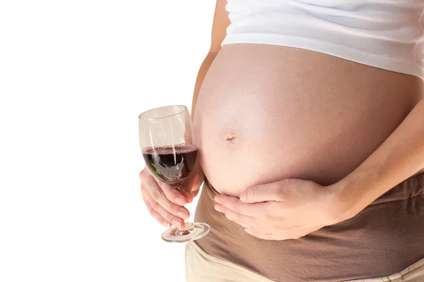 Беременная женщина с бокалом вина — стоковое фото
