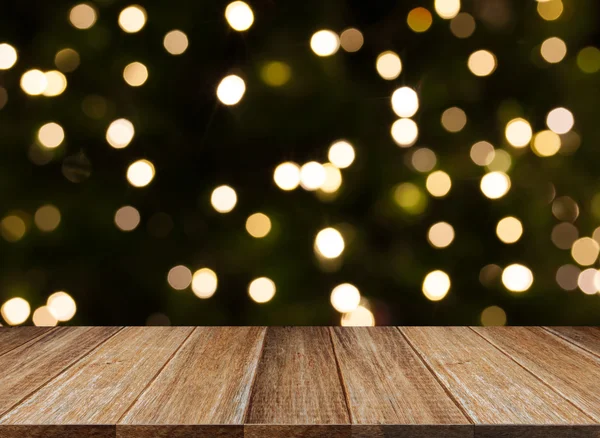 Viering achtergrond van houten tafel op kleurrijke licht bokeh — Stockfoto