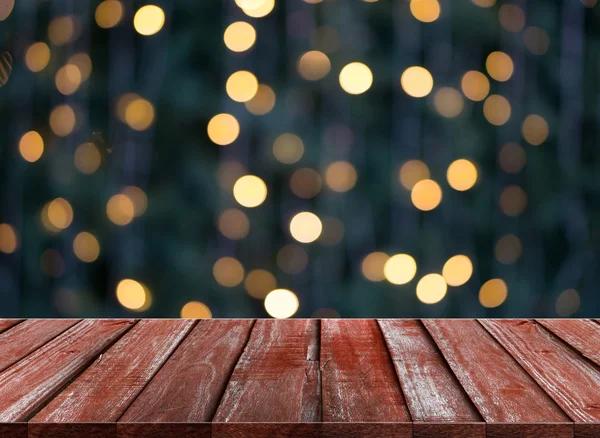 Viering achtergrond van houten tafel op kleurrijke licht bokeh — Stockfoto