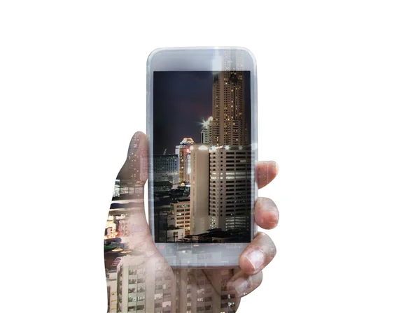 Doble exposición del teléfono inteligente de mano durante la noche de la ciudad — Foto de Stock