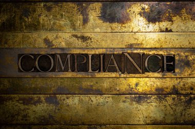 Compliance text message on textured grunge copper and vintage gold background clipart