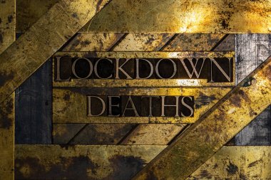 Lockdown Deaths text message on textured grunge copper and vintage gold background clipart