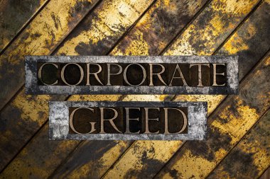 Corporate Greed text on vintage textured silver grunge copper and gold background clipart