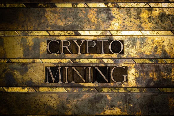 Crypto Mining text on textured grunge copper and vintage gold background