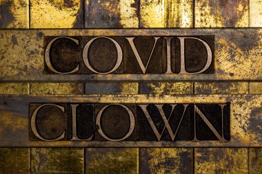 Covid Clown text on vintage textured grunge copper and gold background clipart