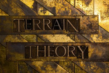 Terrain Theory text on vintage textured grunge copper and gold background clipart