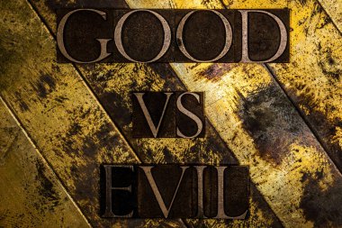 Good vs Evil text on vintage textured grunge copper and gold background clipart
