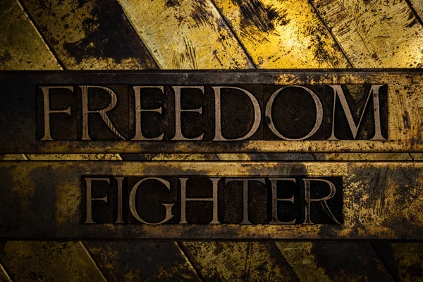 Freedom Fighter Text Message Grunge Textured Copper Gold Background — Stock Photo, Image