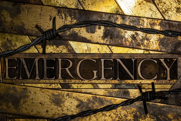 Emergency Text Barbed Wire Vintage Textured Grunge Copper Gold Background — Stock Fotó