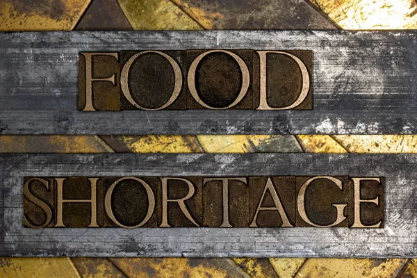 Escasez Alimentos Texto Vintage Texturizado Grunge Cobre Oro Fondo Fotos de stock libres de derechos