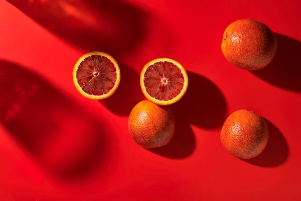 juicy red orange in a cut on a red background