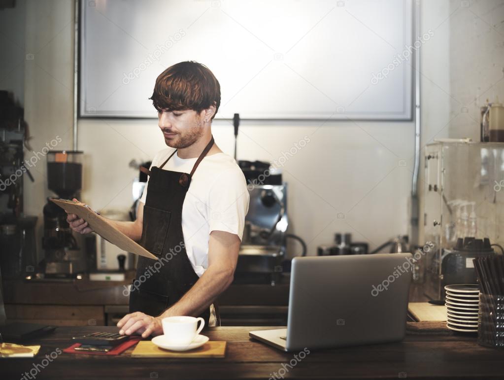 Making Coffee in Barista Cafe