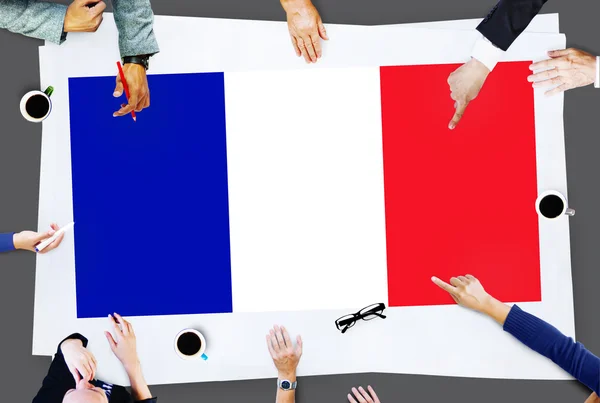 Επιχειρηματίες που δείχνει στη σημαία της Γαλλίας — Φωτογραφία Αρχείου