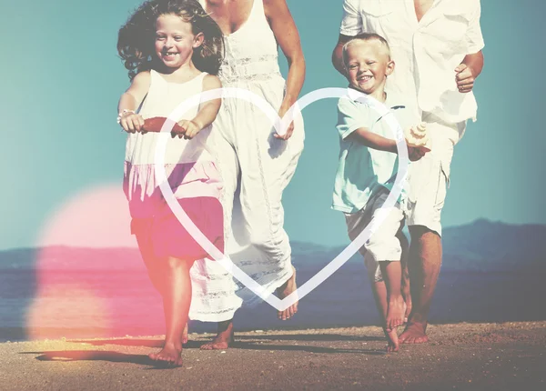 Family having fun on the beach — Stock Photo, Image