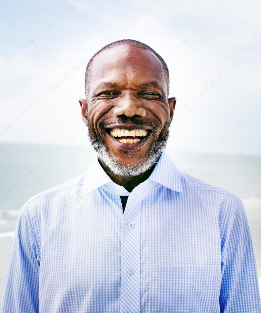 African Man at Beach Vacation Concept