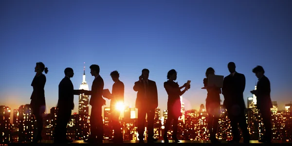 Business People silhouettes on sunset — ストック写真