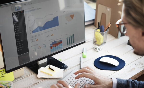 Businessman analyzes on Computer