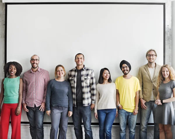 Diversity people stands near wall — Stock Photo, Image