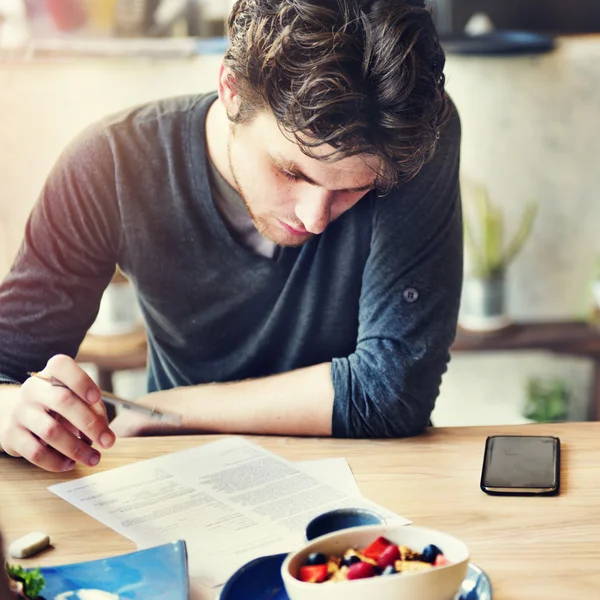 Man Reading and Writing Research Concept