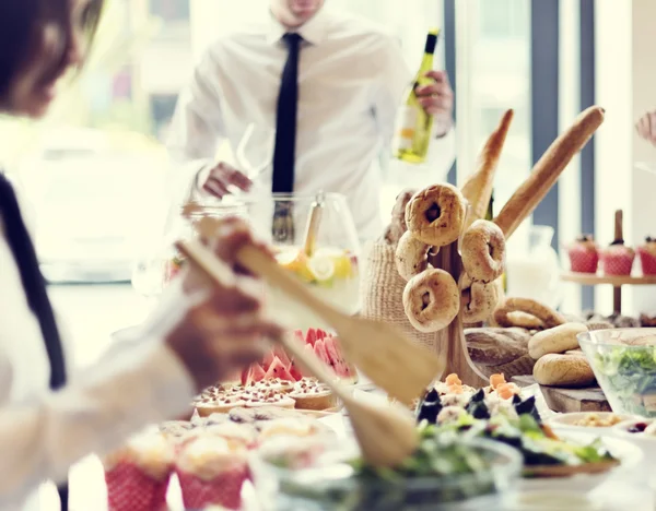 Staff serves buffet table — Stock Photo, Image