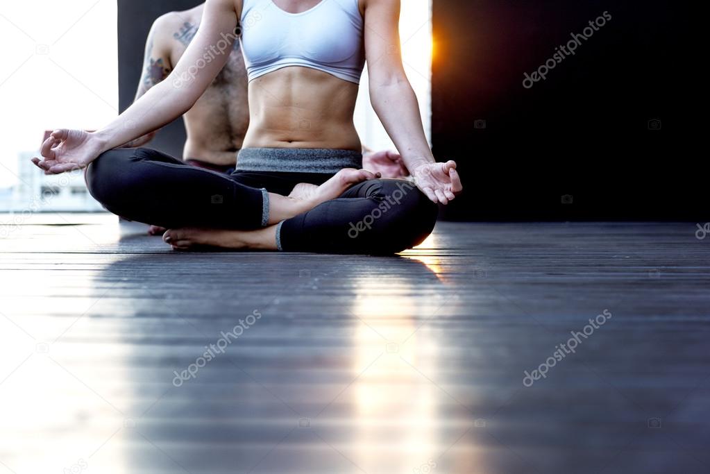 Woman and Man Practicing Pose Yoga 