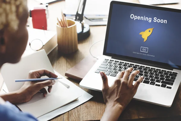 Woman working on laptop with opening soon — Stock Photo, Image