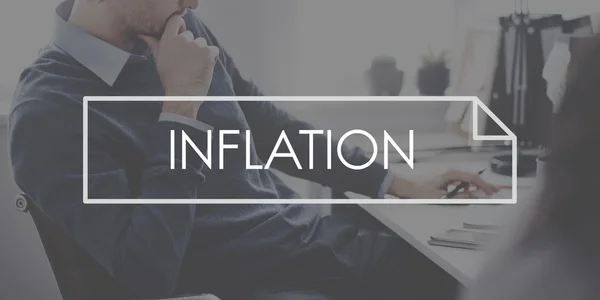 Affärsman tänkande med text inflation — Stockfoto