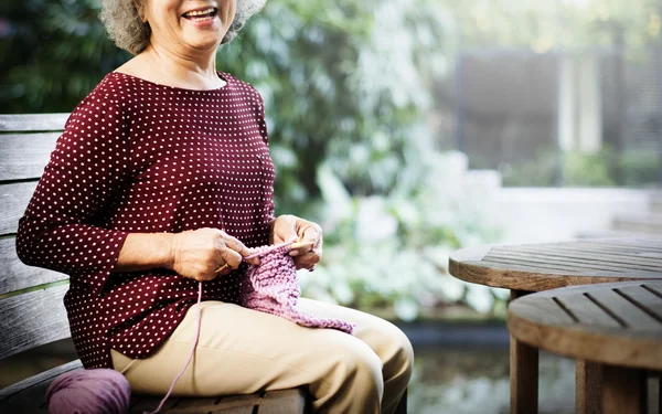 Grandma crocheting Concept — стоковое фото