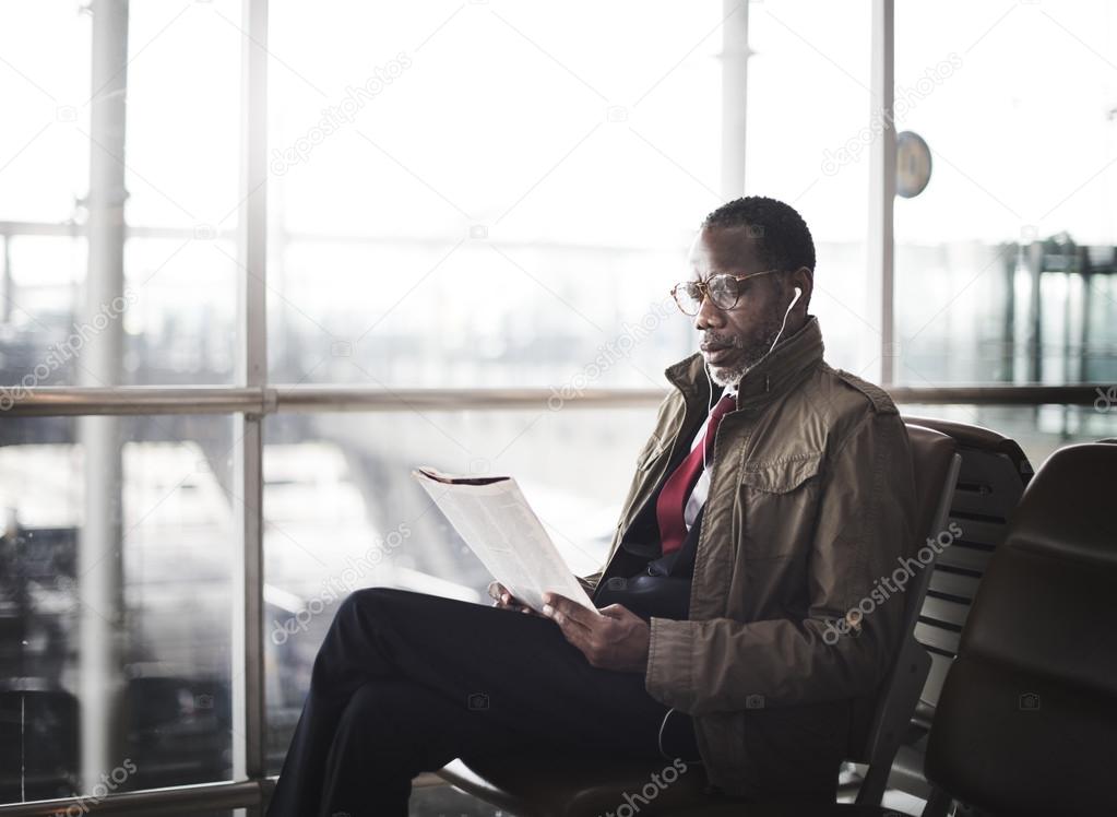 man Waiting on Station and Reading