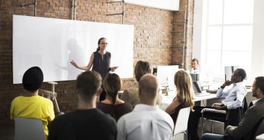 people at conference with white blank board clipart