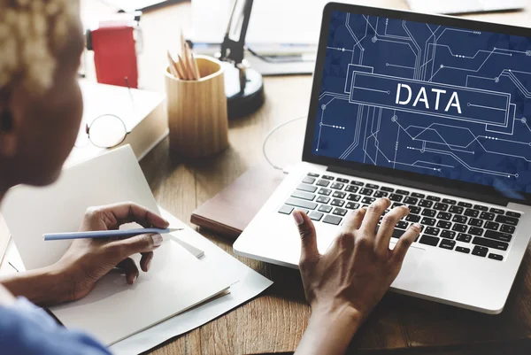 Woman working on laptop with data — Stock Photo, Image