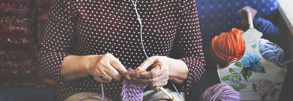 elderly woman crocheting