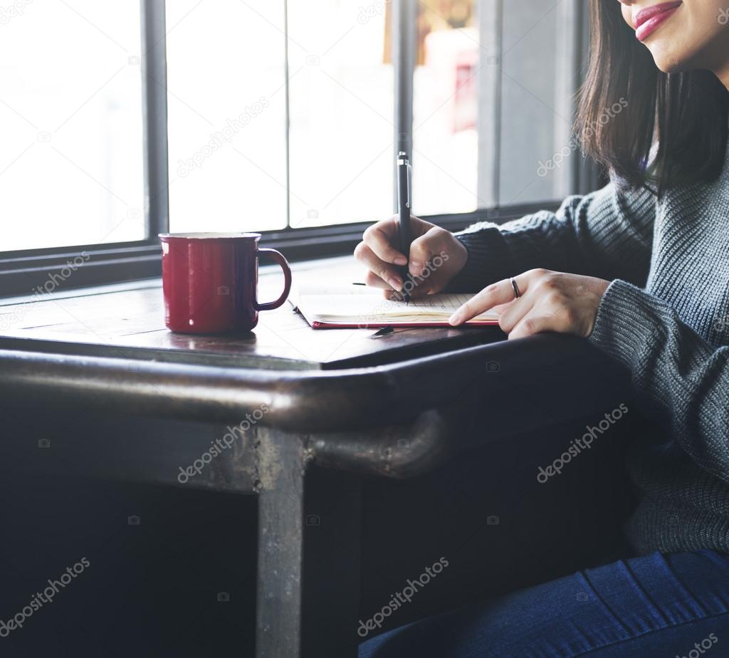 Lady Writing in  Notebook 